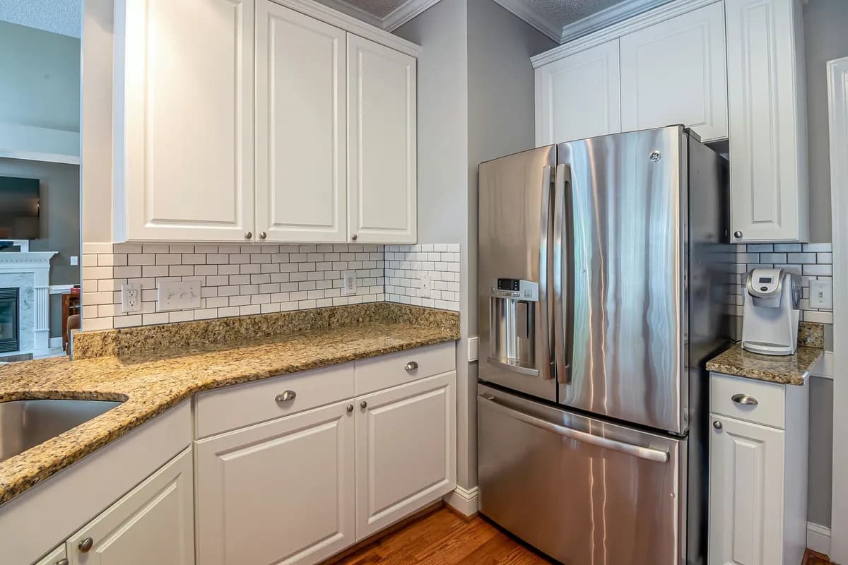 Stainless steel refrigerator with an ice and water dispenser
